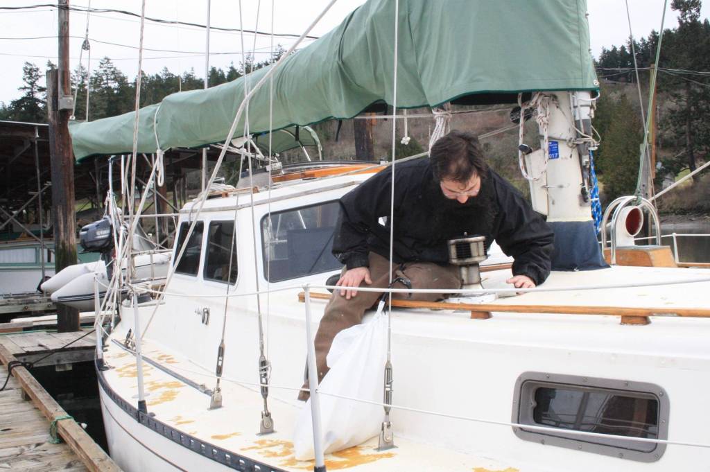 Staff photo/Hayley Day                                Nate Hertel repairs a boat deck at Albert Jensen and Sons Boat Yard and Marina on San JuanIsland.