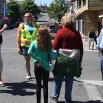 Staff photo/Hayley Day                                A Washington State Ferry employee answers questions about delays at the Friday Harbor terminal on Tuesday, July 18.