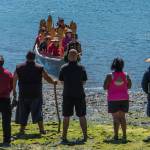 Contributed photo/Chris Teren                                Islanders watch as tribal canoes row to the shores of English Camp.