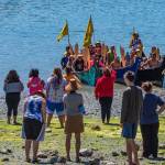 Contributed photo/Chris Teren                                Islanders watch as tribal canoes row to the shores of English Camp.