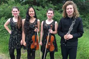 From left to right: Lisa Carter, Paris Wilson, Emy Carter and Tate Cohan before Martin Lund&rsquo;s One World concert at Orcas Center.