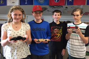 OCS students learn physics with wooden derby cars