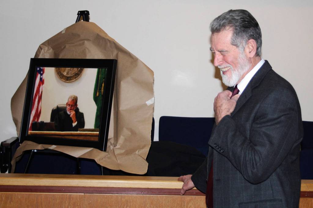 Staff photo/Hayley Day                                San Juan County Superior Court Judge Donald Eaton smiles in front of his portrait.
