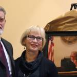 Staff photo/Hayley Day                                San Juan County Superior Court Judge Donald Eaton and his wife Sheryl smile in front of a portrait painted by Barnaby Zall, a local attorney.