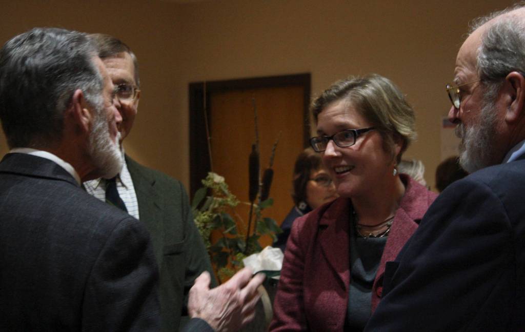 Staff photo/Hayley Day                                Katie Loring, who will replace Donald Eaton as San Juan County Superior Court Judge, talkswith the retiree.
