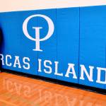 Island Market donates new wall mats to high school