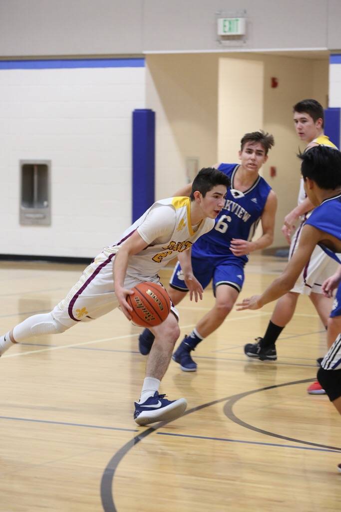 Saints boys basketball ends on a united front