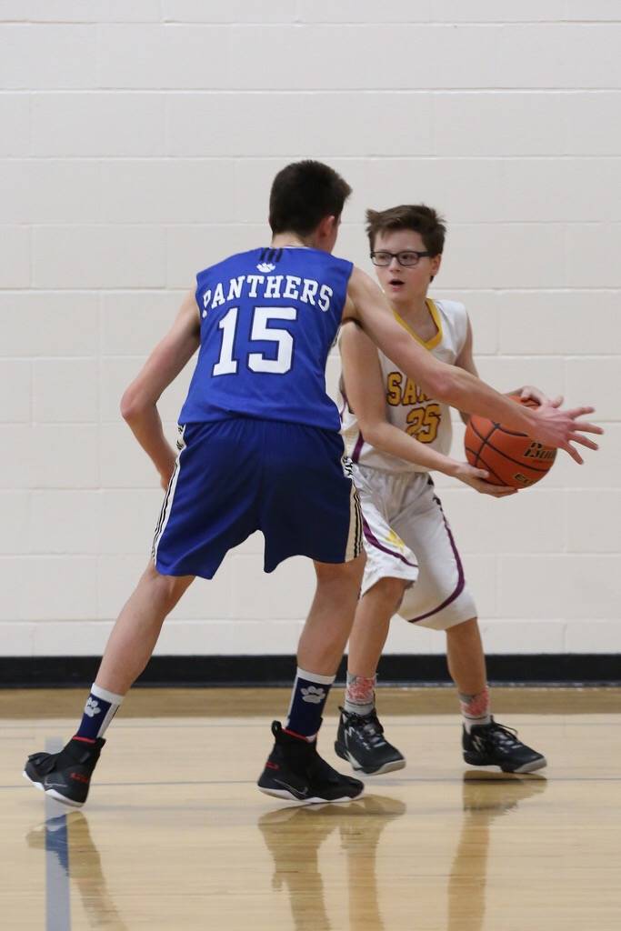 Saints boys basketball ends on a united front