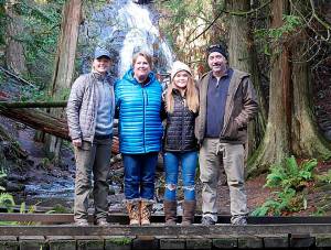 Terri and her husband Cal with Lillian (left) and Emma (right).
