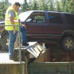 SUV dangles dangerously at Lopez Dump