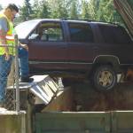 SUV dangles dangerously at Lopez Dump
