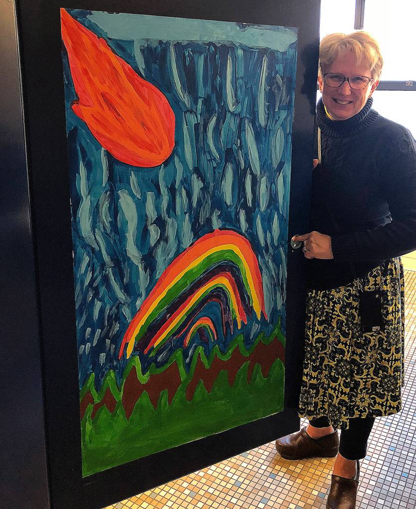 Principal Lorena Stankevich with some of the student art.
