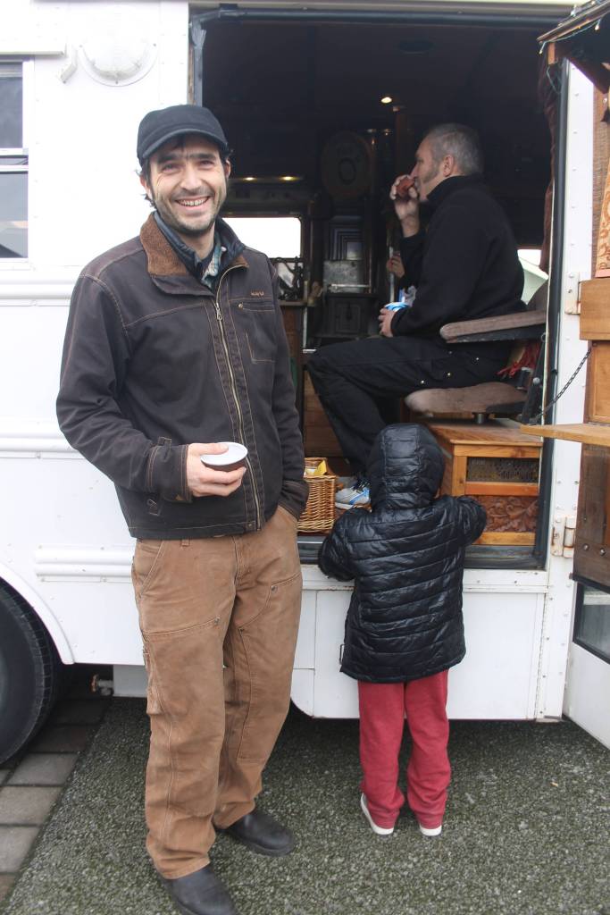 Heather Spaulding/staff photo                                Guisepi aka Joe, Spadafora, sips tea while talking with an island mom and her children.