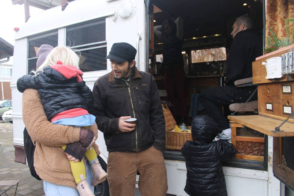 Heather Spaulding/staff photo                                Guisepi aka Joe, Spadafora, sips tea while talking with an island mom and her children.