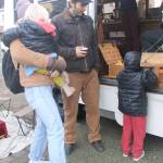 Heather Spaulding/staff photo                                Guisepi aka Joe, Spadafora, sips tea while talking with an island mom and her children.