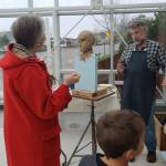 Contributed photo/SJIMA                                Onlookers watch Gareth Curtiss on the first day of sculpting.