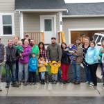 Contributed photo/Homes For Islanders                                Volunteers and homeowners celebrate Homes For Islanders most recent built at the end of Malcolm Street on Oct. 7.