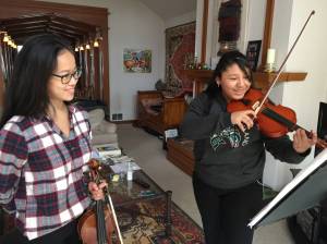 Paris Wilson (left) teaching a student.