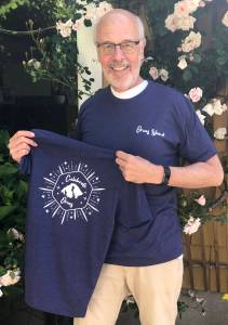 Colleen Smith/staff photo                                Lance Evans wearing one of the shirts and showing the back design.