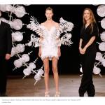 Contributed photo from The New York Times, featuring the finale Infinity dress (center).