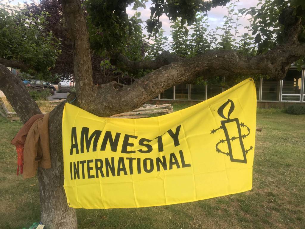 Local speakers inspire action at local vigil protest of ICE detainment camps