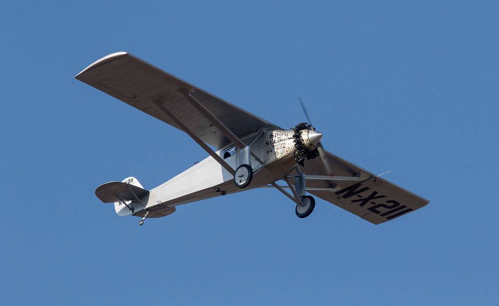 Pilot Ron Fowler takes John Normans replica of the Spirit of St. Louis on its first flight and circles around Arlington Municipal Airport on July 28. Normans replica is considered the most accurate replica made so far. (Andy Bronson / The Herald)