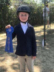 Grace Zwilling shows off one of several first place ribbons at the 2019 San Juan County Fair