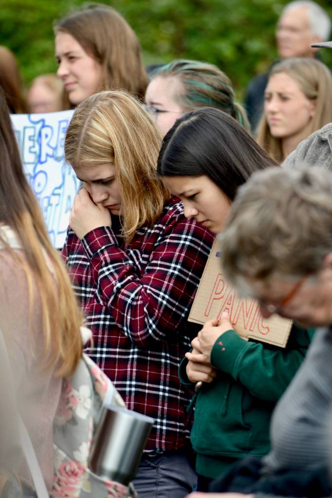 Contributed photo by Corey Wiscomb.                                Friends console each other on the Village Green during the Global Climate Strike on Friday, Sept. 20