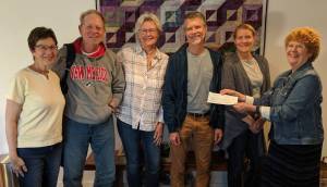 Contributed photo                                Orcas Community Resource Center staff and board members accept a check from Emmanuels Market Day. Left to right: Resource Center board members Judy Scott, Steve Jung, Carolyn Morrow Fiscus and Hugh Grant, Executive Director Erin ODell; and Emmanuel co-Treasurer Margie Bangs. (Bangs is also an OCRC board member.)