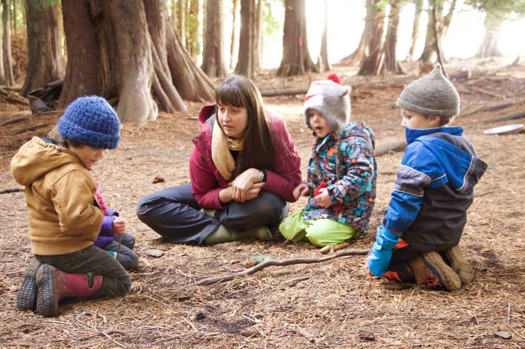 Laura Kussman/staff photo                                Kimberly Worthington, a forest school program Specialist and lead teacher with a passion for early childhood environmental education, tells an interactive tale of the Three Little Pigs.