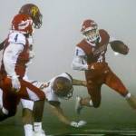 Marysville Pilchucks Dillon Kuk carries the ball with Prairies Ian Davis trailing during a playoff game on Nov. 15, 2019, at Quil Ceda Stadium in Marysville. (Kevin Clark / The Herald)