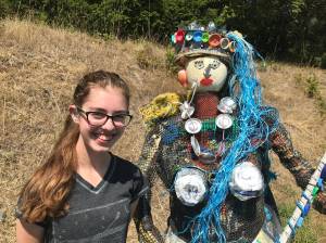 Contributed photo                                Kaia at the Lopez Dump with a mermaid made of litter.