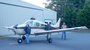 Laura Kussman/Staff photo
From right to left: Tony Simpson, David Billings, David Janecek and Ken Loock stand with the Airhawks Flight Club airplane  a 1993 Beechcraft Sundowner purchased in the summer of 2019 to provide more training options for student pilots and increases flying opportunities for current pilots.