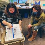 San Juan County Health and Community Services Department staff opening the first shipment of COVID vaccine to arrive in the islands. (Contributed photo)