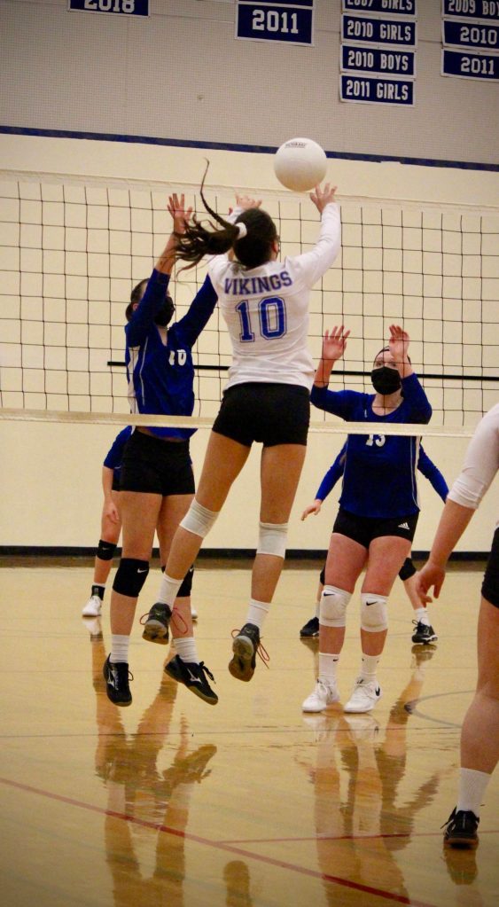 Corey Wiscomb/contributed photo
Senior Darian Johnson (10) throws a new twist into the mix by placing a short jump set over the defenders intending to block her notorious spike.