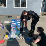 Students decorating one of the food distribution cabinets. (Contributed photo)