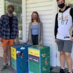 Students standing next to food distribution cabinets. From left to right: Francis Black, Linnea Morris, and Julian Rich. (Contributed photo)