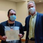 Contributed photo
Jordan Lynn-Jefferson receiving a Certificate of Graduation from San Juan Drug Court with Brad Fincher, Drug Court Case Manager.