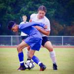 Corey Wiscomb photo
Whoever said soccer isnt a physical game probably hasnt played in an Orcas vs. Friday Harbor match! Here Pedro Banderas uses dominant position to shield the ball from a larger FH player before passing off to an open teammate.