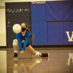 Corey Wiscomb photo
Sophomore Milana Schneider gets low to keep the ball up and in play for her Vikings.