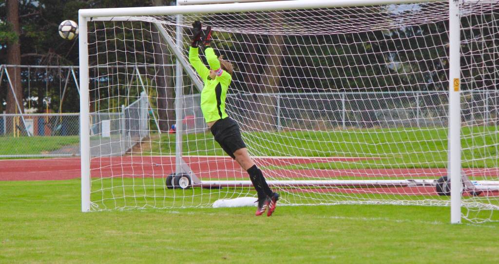 Corey Wiscomb photo
Junior Goalkeeper Paxton White leaps to the corner to block a LaConner Brave shot on goal.