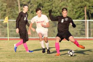 Corey Wiscomb photo
Junior Diego Lago pounds one upfield with the left foot. Lago will be an essential defender for the Vikings in the postseason.