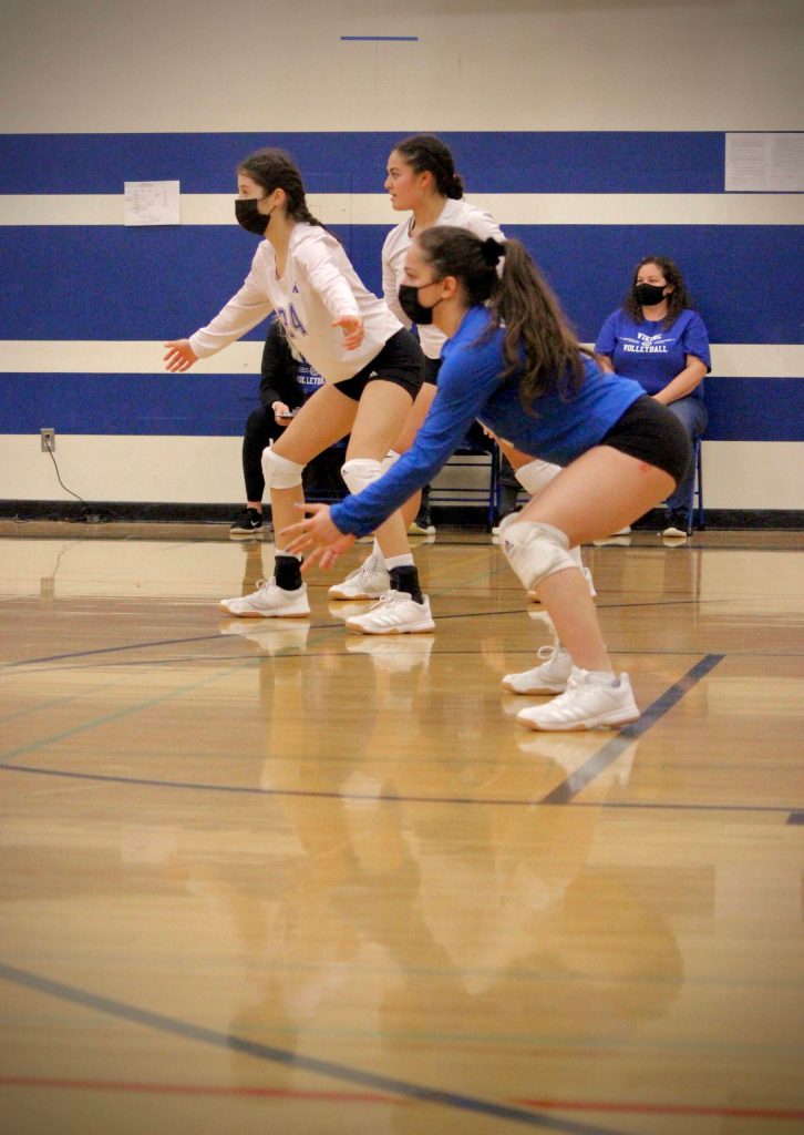 Corey Wiscomb photo
Bring it on. Ava Ashcraft, Tayla Malo, and Milana Schneider prepare to receive the serve.