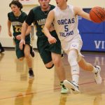 Corey Wiscomb photo
Leading a Viking fastbreak is Junior Guard Diego Lago. Lago was well balanced in this game with targeted passes, solid drives to the hoop, and a barrage of three-point baskets that were like daggers to the Darrington Logger hopes.