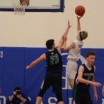 Corey Wiscomb photo
Sophomore Sam Sutton drives baseline with a nearly patented floater against Providence.