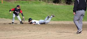 Corey Wiscomb photo
Sliding head first into third base for a safe steal is Diego Lago during the game against Coupeville.