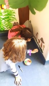The kids painting.