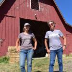 Kelley Balcomb-Bartok  Staff photo
Braunti Cobb and Julie Duke stand in front of the barn that houses all the animal feed for the sanctuary.