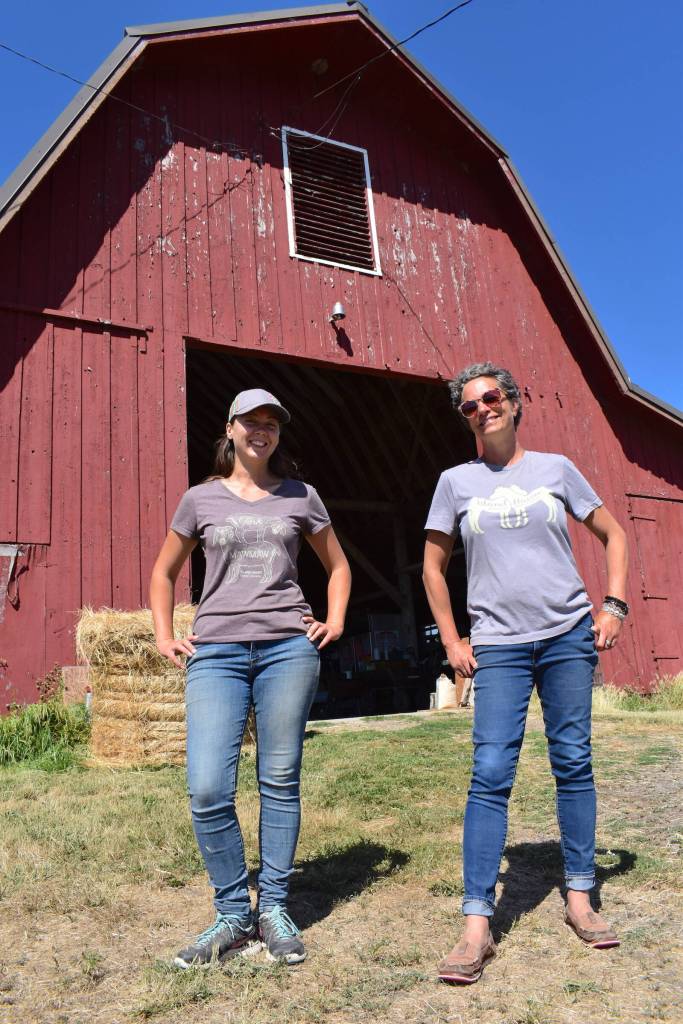 Kelley Balcomb-Bartok  Staff photo
Braunti Cobb and Julie Duke stand in front of the barn that houses all the animal feed for the sanctuary.