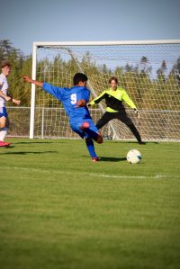 Corey Wiscomb photo
Senior Pedro Guerra Banderas on the attack against Grace Academy.